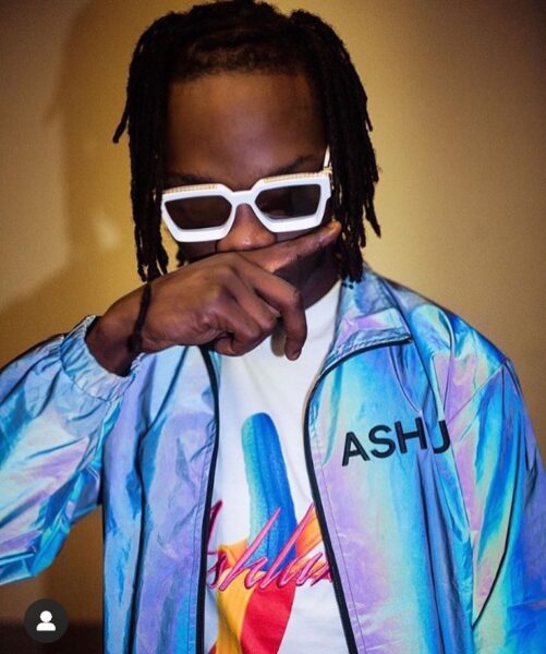 Naira Marley's Fan Tattoos the singer's face on her back.