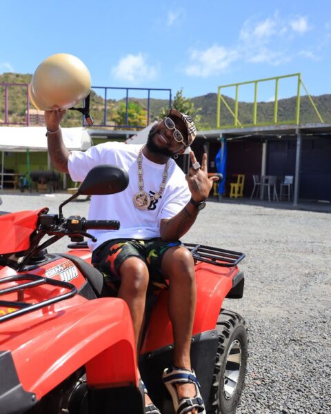 Davido steps out with another woman on vacation, causes an uproar.