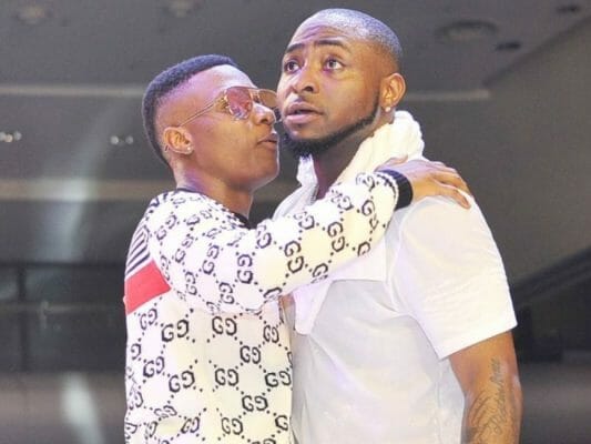 Davido and Wizkid spotted hugging themselves in a trending video