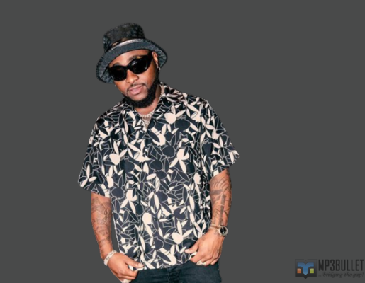 Davido stirs reactions as he gifts a lady his shoe and N2M